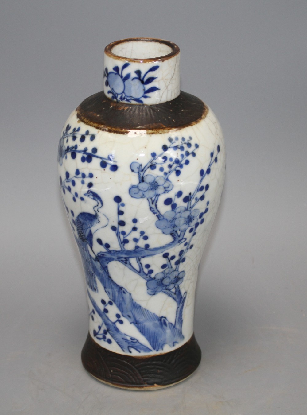 A Chinese crackle glaze baluster vase, decorated with peacocks and prunus blossom, height 25.5cm